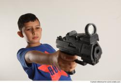 TIMBO STANDING POSE WITH GUN